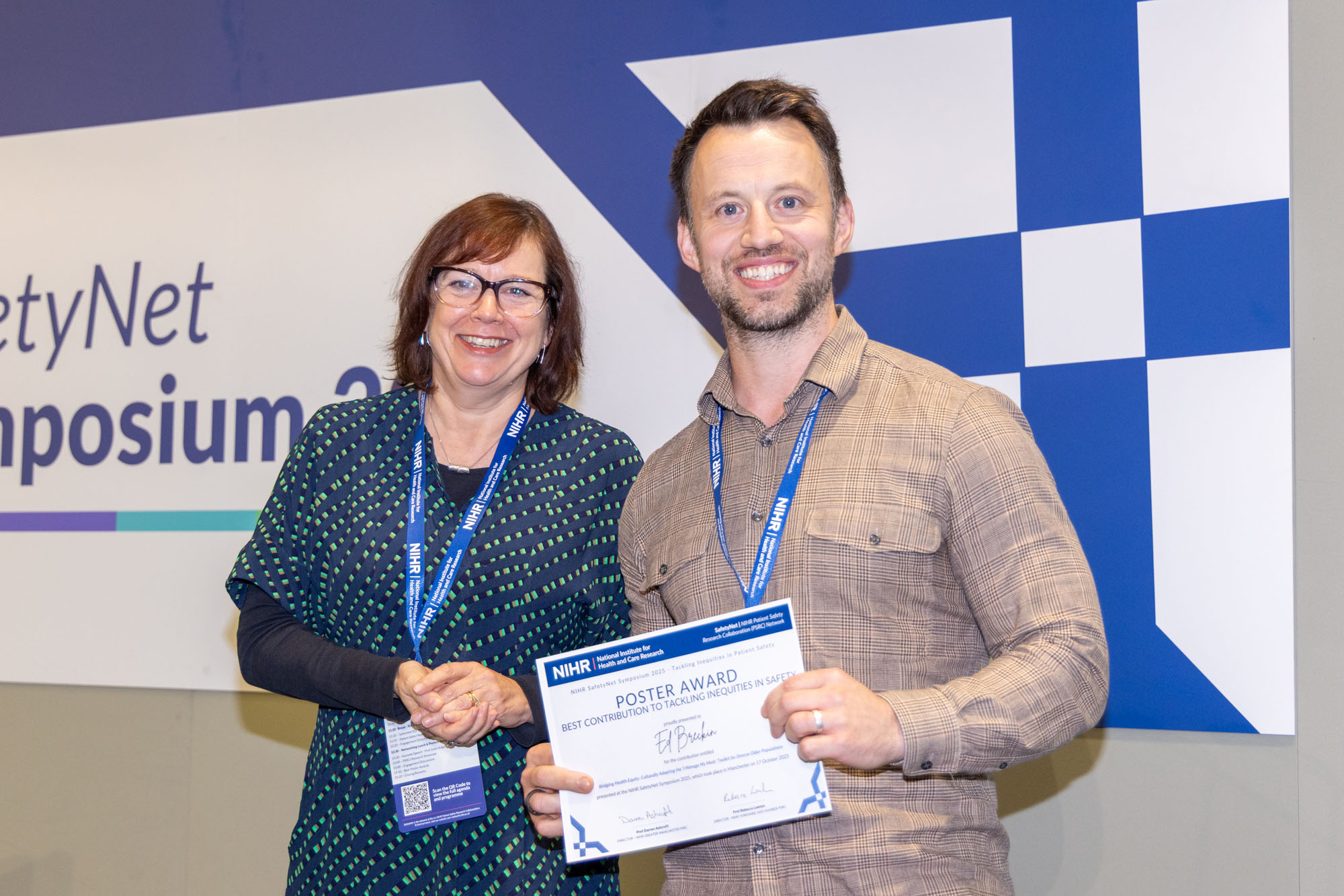 Ed Breckin receiving the award from the chair, Prof Rebecca Lawton